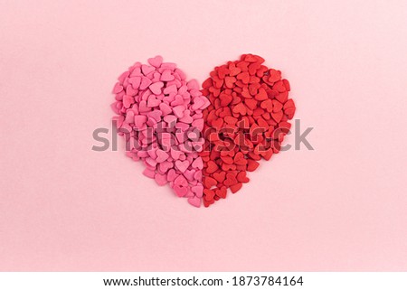 
Pink and red Valentines Day heart shaped candy on a pastel background.Flat lay, top view hearts texture. Love concept.Sainte Valentine, mother's day greeting cards, invitation.