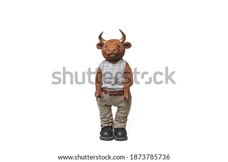portrait of a toy bull in teddy technique. isolated on white