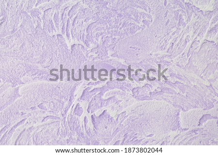 Lacquered stucco wall texture background in lilac color. Decorative and stucco in the loft style.