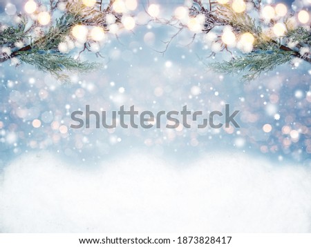 winter christmas background with fir branches cones and snow garland lights