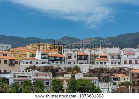 Architecture. Houses on a mountain background.. Stock photo