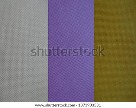Colorful polypropylene material of fabric rolls - texture samples Non Woven Fabric isolated on white background.