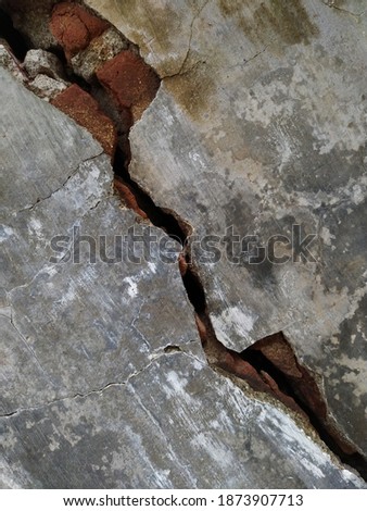 Photo of Gray cracked wall