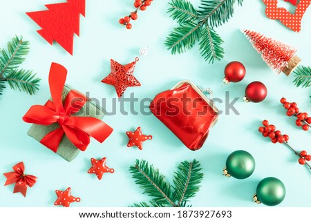 Christmas holiday composition. Xmas gifts and decorations, fir tree branches on pastel blue background. Christmas, New Year, winter concept. Flat lay, top view, copy space