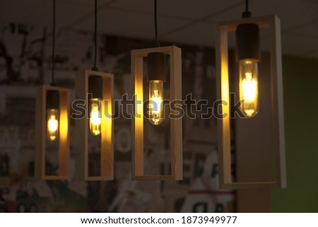 Vintage ceiling light, industrial style hanging light bulbs. Lighting, vintage and interior design concepts. Horizontal close-up.