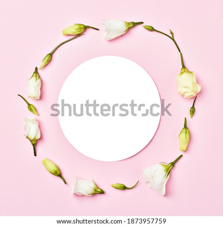 Close up of a note paper invitation card flat lay in floral environment, nature concept
Creative layout made of flowers and leaves. Floral Greeting card