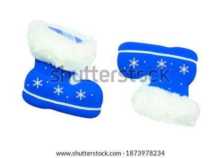 Christmas decorations. A pair of blue Christmas boots or Santa Claus boots with white star ornaments isolated on a white background.