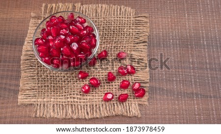 Fresh Pomegranate rich in natural antioxidants. Concept of red fruits, vitamins and natural antioxidants to the skin for beauty.