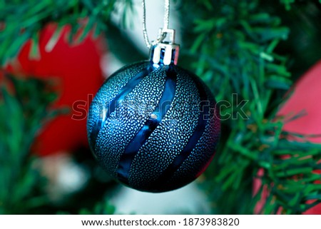 Christmas decoration ball in a Christmas tree, selective focus