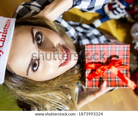 beautiful young girl in a christmas gift