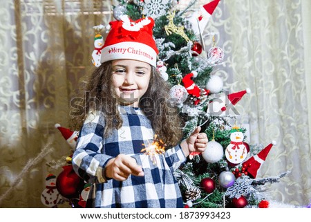 small girl with christmas sparkler