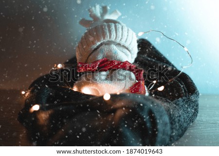 Snowy christmas decoration with warm lights