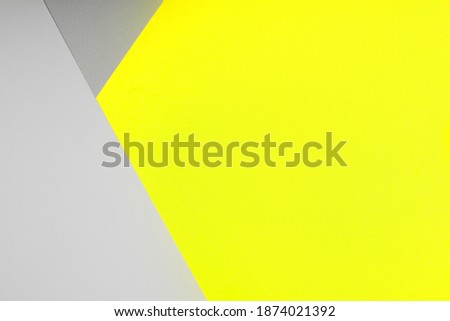 Paper background in two trendy colors - yellow and gray. Demonstrating colors of 2021 year