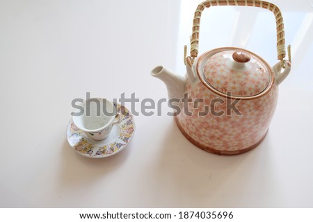 
colorful mini teapot and teacup