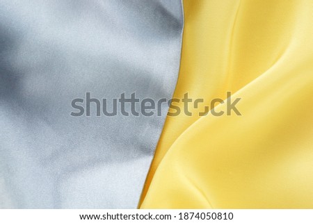 silk fabric texture background  banner color of the year 2021 illuminating and ultimate gray . copy space