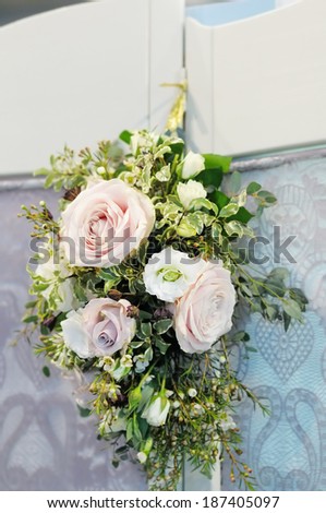 Beautiful composition of white and pink roses on wall