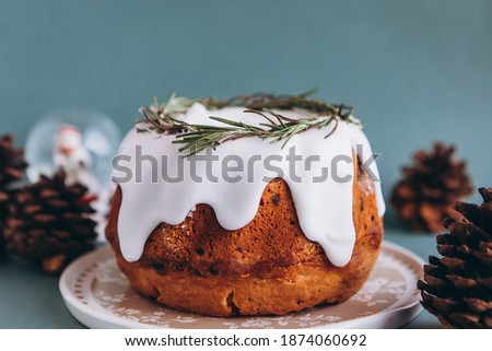Christmas bundt cake served on table and decorated with Xmas holiday decorations, blank space for a greeting text