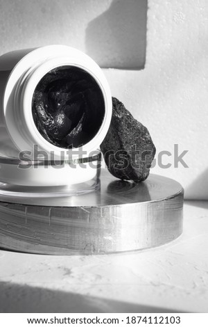 black mask with crub by activated charcoal powder and caviar on metal ultimate grey color, selective focus