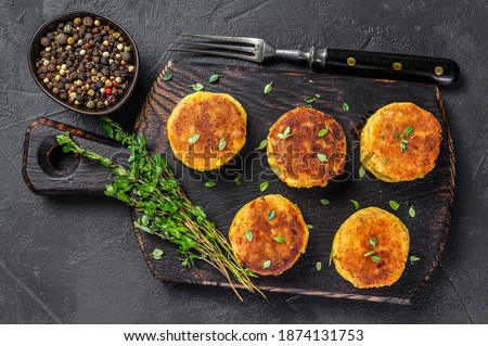 Vegetarian vegan burgers patty with vegetables and herbs. Black background. Top view Royalty-Free Stock Photo #1874131753