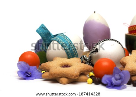 Happy Easter. Easter eggs with biscuits and sweets. Photo.