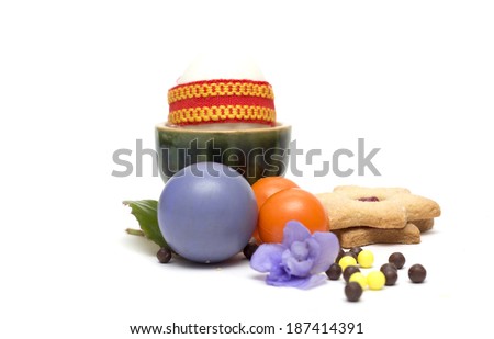 Happy Easter. Easter eggs with biscuits and sweets. Photo.