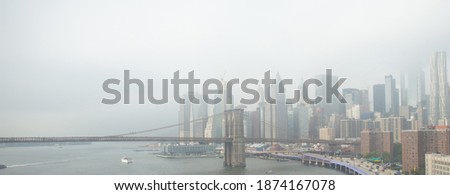 
panorama of new york city and brooklyn bridge over hudson river