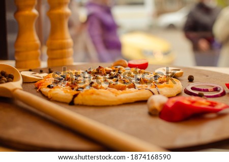 Pizza on the background of a restaurant window, selective focus