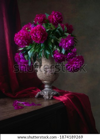 Still life with bouquet of purple flowers