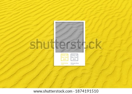 closeup of sand pattern of a beach in the summer. Illuminating and Ultimate gray Pantone color of the year 2021
