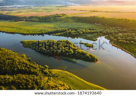 Stunning top view of the sinuous Dniester River. Location place Dnister canyon of Ukraine, Europe. Aerial photography, drone shot. Picturesque photo wallpaper. Discover the beauty of earth.