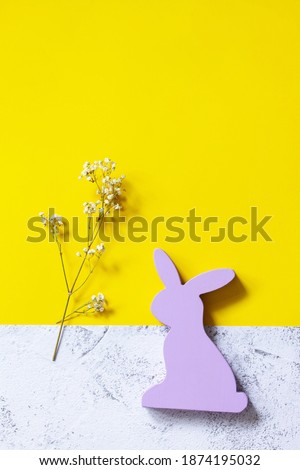 Happy Easter mockup. Easter bunny on slate background. Illuminating Yellow and Ultimate Gray Color of the year 2021. Top view flat lay background.