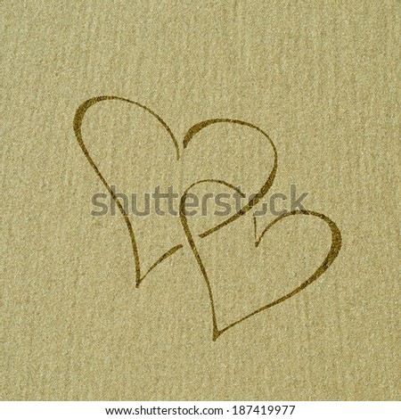 Heart shape on the sand surface