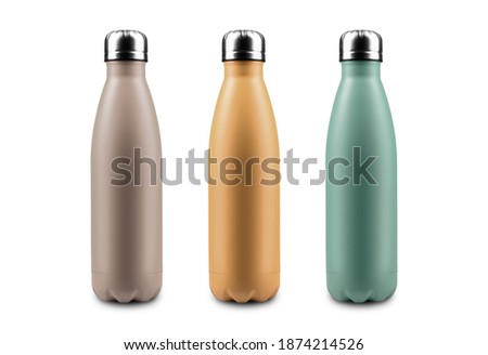 Set Sail Champagne, Fortuna Gold, Tidewater green; Colors of 2021. Close-up of reusable, eco steel thermo water bottles isolated on white background. Royalty-Free Stock Photo #1874214526