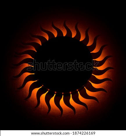 red sun with led on the wall