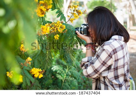 Leisure activities of girl photographer in fine weather