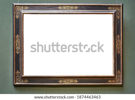 Empty picture frame on an exhibition wall