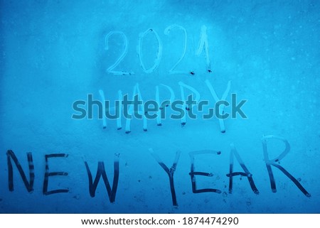 numbers 2021 painted in snow.  happy New Year holidays - inscription. greeting card       