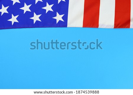 United States of America flag on a blue background with space for text