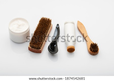 Shoe Polishing Cream And Brushes Royalty-Free Stock Photo #1874542681