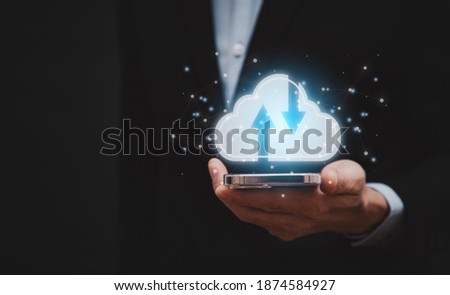 Businessman holding tablet or mobile connect to data information on the cloud icon computing network., Backup Storage Data Internet, networking and digital, Share global, and technology, concept.