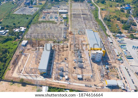 Aerial view of electricity generating, voltage poles. Power lines on utility tower and cable wires in energy electric technology, network, and industry. Generator pylon. Transmission and substation.