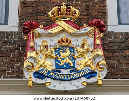 Coat of Arms with the motto Je Maintiendrai (I will hold) of the Dutch Royal Family on an old building in Zierikzee, the Netherlands.