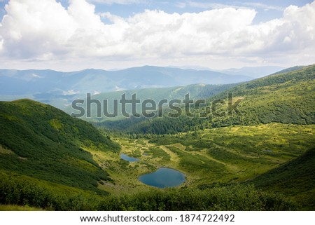 Picturesque view of the mountains that glow under sunlight. Dramatic morning scene. Location place Carpathian national park, Ukraine, Europe. Artistic picture. Beauty world. Warm toning effect.