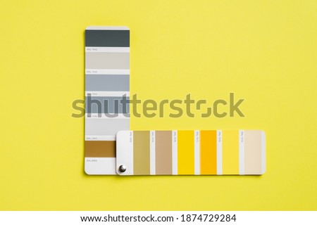Palette with color of the year 2021 - Ultimate Gray and Illuminating yellow. Trendy color swatches. Flat lay, top view.