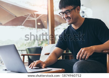 man work using computer hand typing laptop keyboard contact us online chatting search form internet sitting at office.concept for technology device communication business people