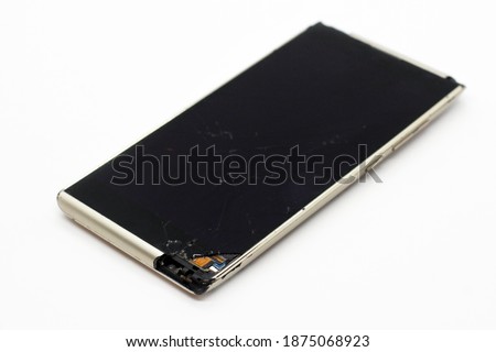 Mobile smartphone with broken screen on a white background. Device.