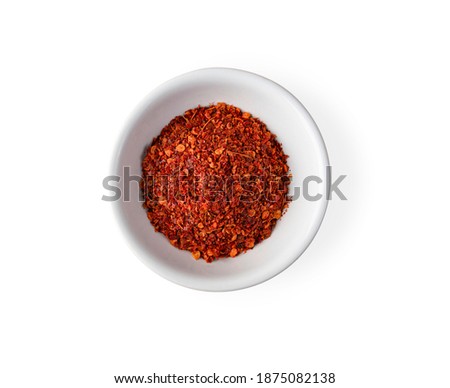 Cayenne pepper in a cup isolated on white background. Top view Royalty-Free Stock Photo #1875082138