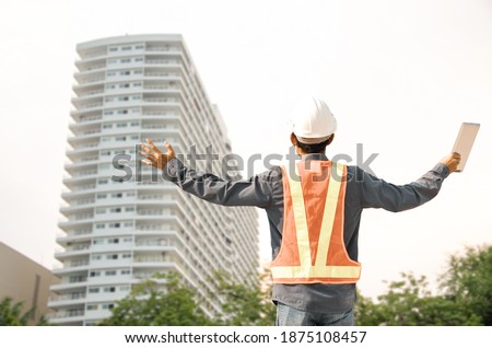 Construction engineer congratulates after completing the building construction project Royalty-Free Stock Photo #1875108457