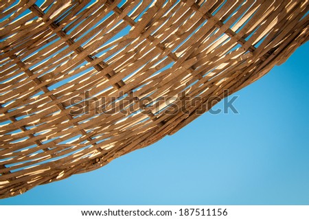 Background  rattan parasol of wicker