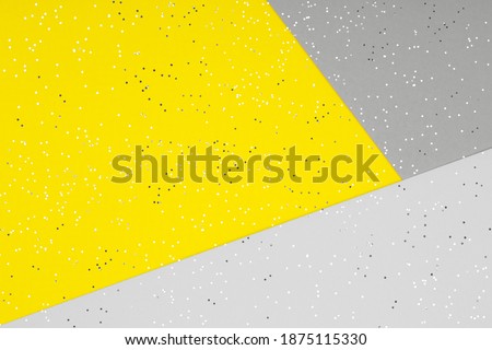 Paper background in two trendy colors - yellow and gray. Demonstrating colors of 2021 year